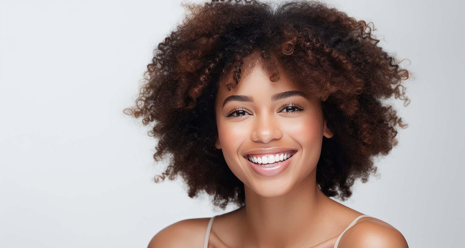 Smiling woman with bright teeth after bleaching in Zurich-Enge Smiling woman with bright teeth after bleaching in Zurich-Enge